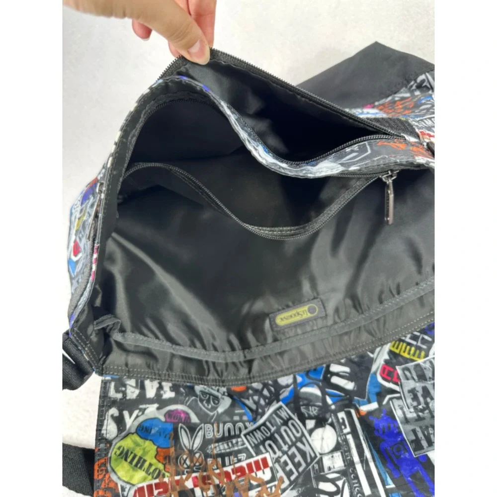 LeSportsac Graffiti Sticker Bomb Messenger Bag Black Multi Ripstop Crossbody
